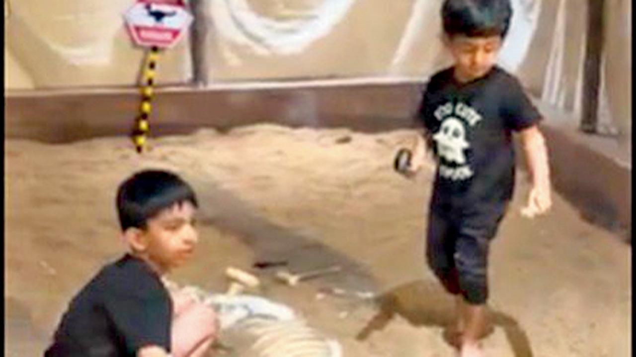 Children excavate mock bones
