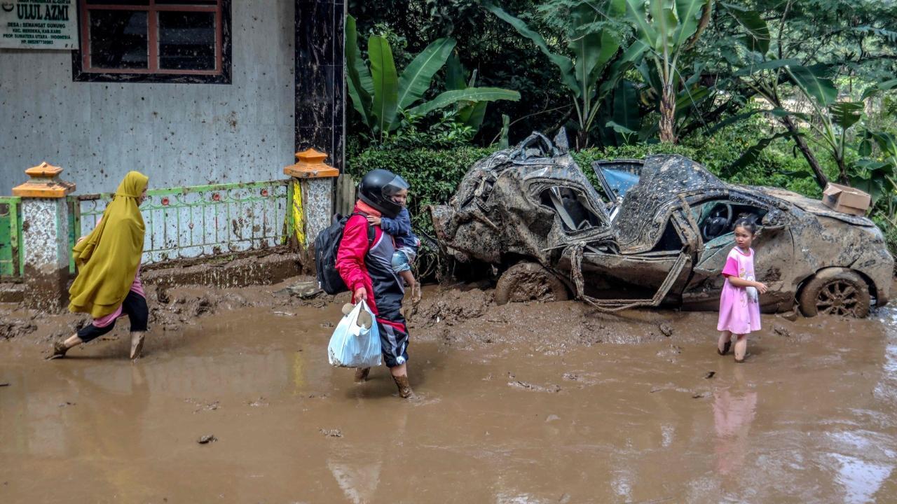 IN PHOTOS: Rescuers recover 20 bodies after floods, landslides in Indonesia