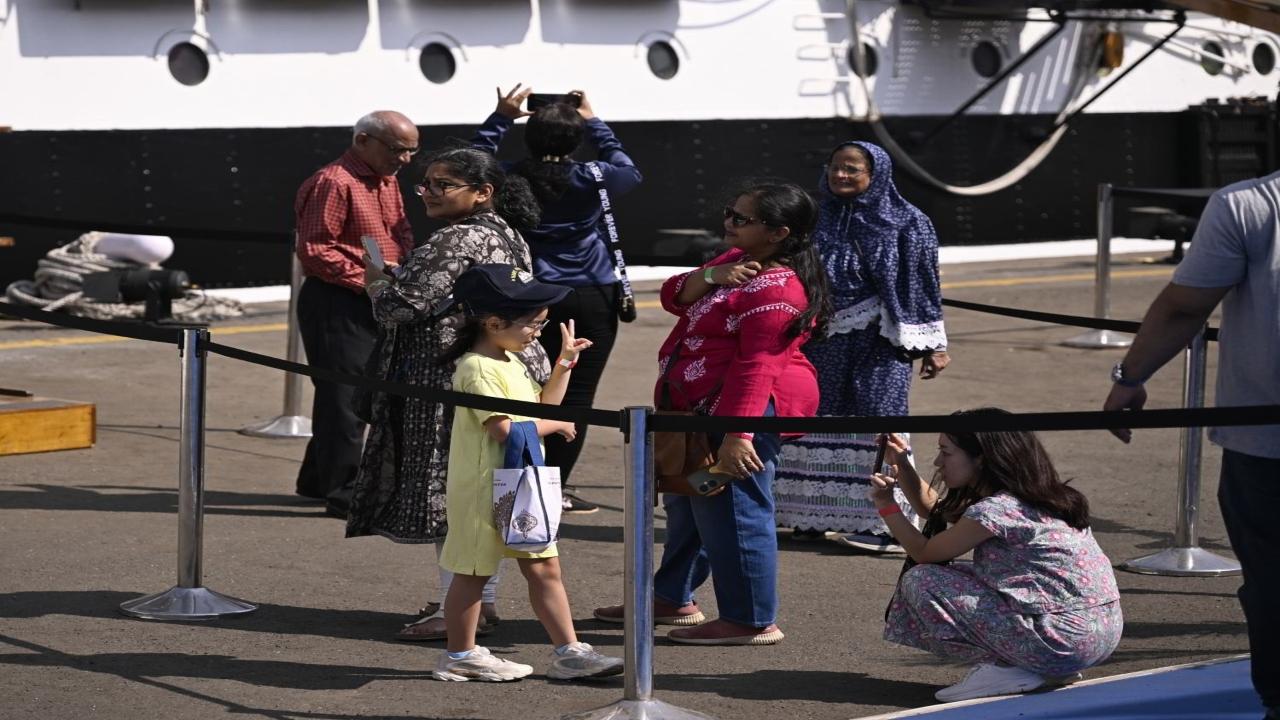 Visitors click pictures on the ship