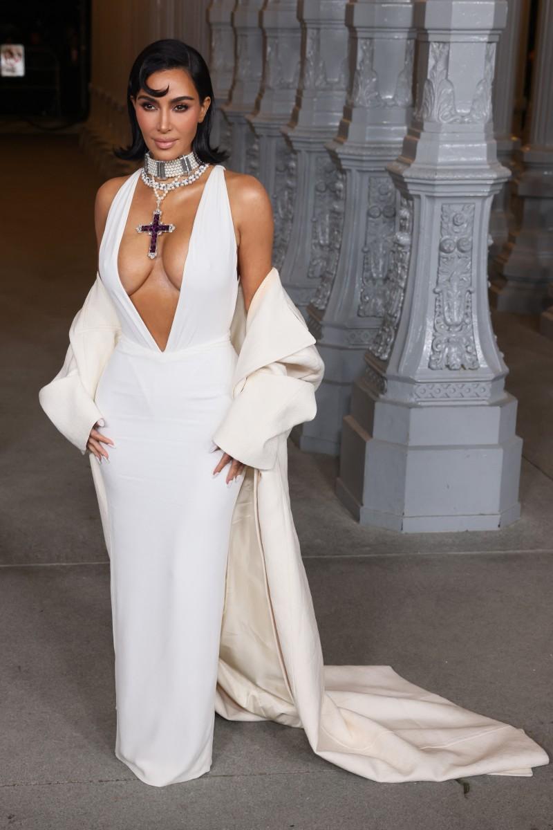 Kardashian paired her look with an ivory coat worn off the shoulder. She completed her outfit with a layered pearl choker that closely resembles another piece of jewelry that belonged to Diana.