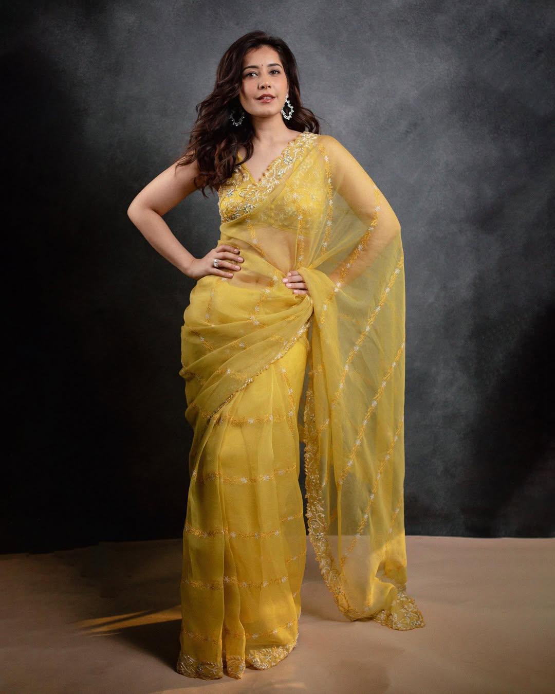 In this look, the actress wore a sheer yellow saree featuring floral embroidery, paired with a strappy blouse.  