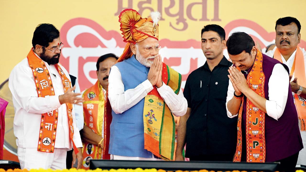 (From left) Chief Minister Eknath Shinde, Prime Minister Narendra Modi and Deputy Chief Minister Devendra Fadnavis on stage during the Mahayuti rally on Thursday. Pic/Rane Ashish
