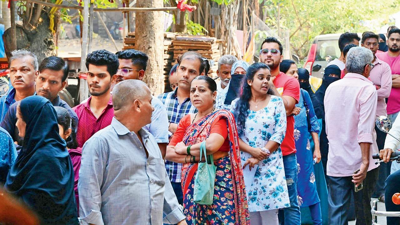 People wait in line to vote in Malad West on Wednesday.  Pic/Nimesh Dave