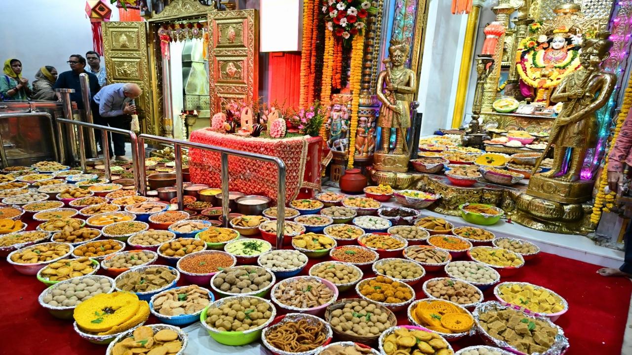 The temple priests perform the traditional puja while chanting mantras while offering the food to the goddess. The offerings are then distributed among the devotees