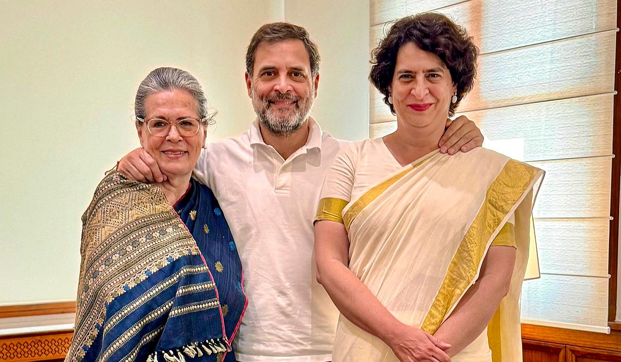 The MP from Wayanad in Kerala held up a red and black copy of the Constitution, which Rahul Gandhi has been displaying at his public meetings, as she took her oath