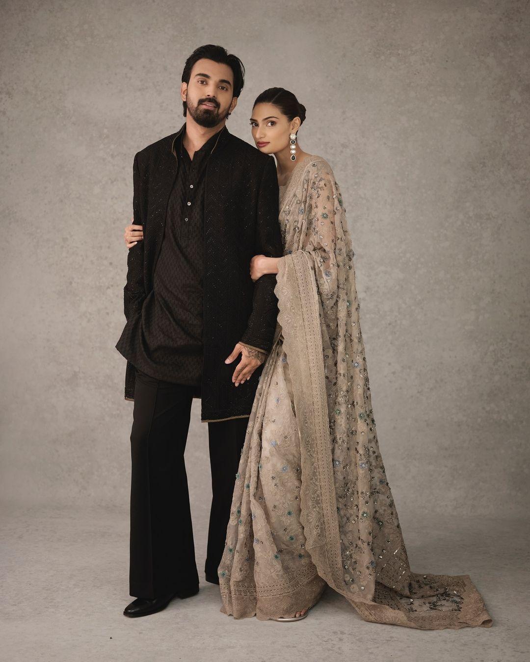 Shetty looked gorgeous in a heavily embroidered beige saree, while Rahul stole the spotlight in a sleek black ensemble, both exuding confidence and style.