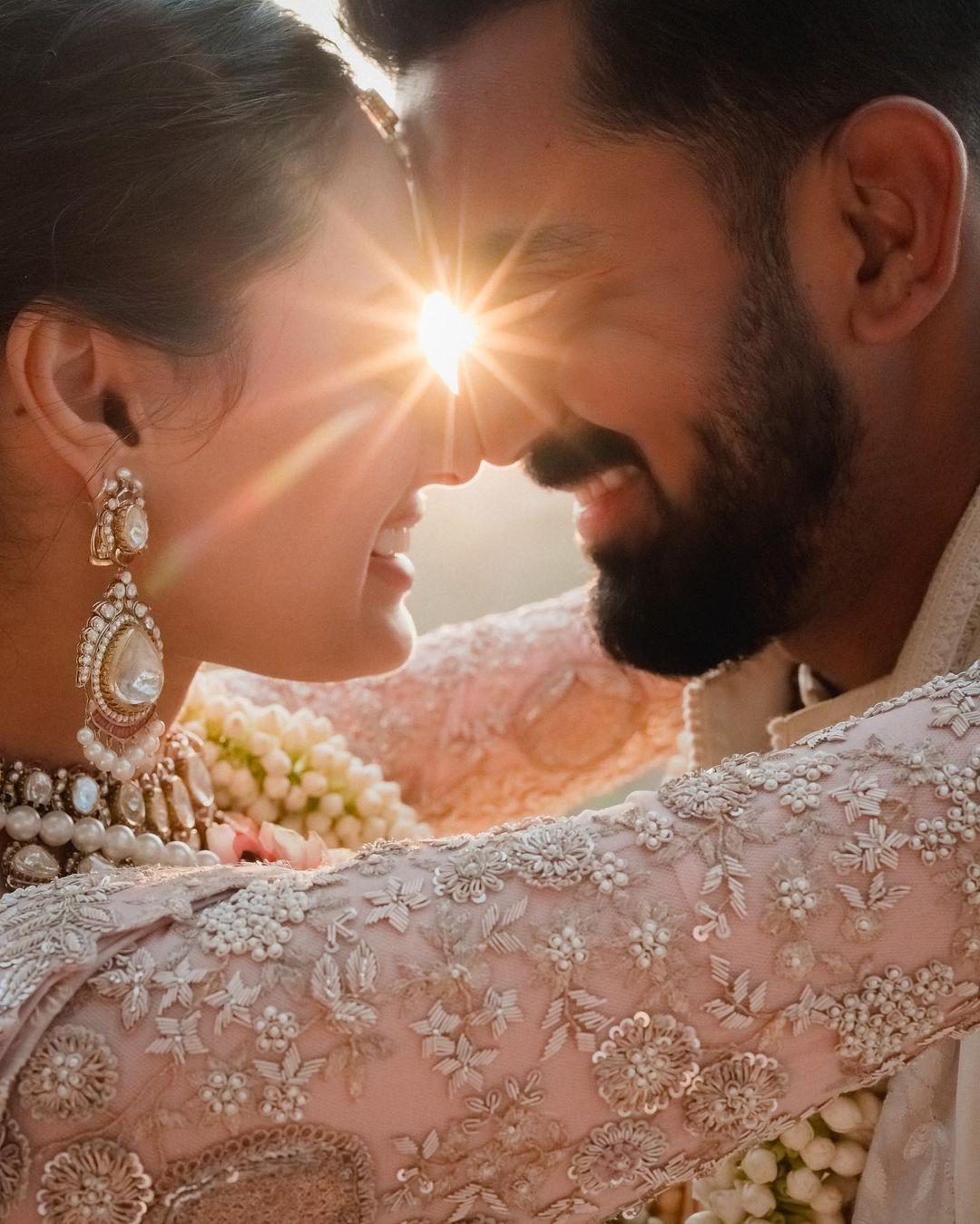 In one particular photo, the sun seems to play a magical role, casting a golden glow on the couple as they stand close to each other, creating a picture-perfect moment. 