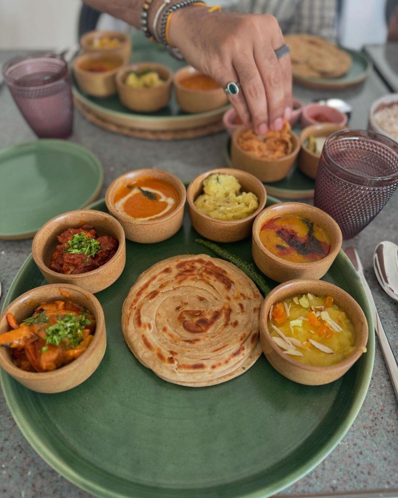 Rhea enjoyed a thali at the resort that included a paratha with some vegetable preparations and other side dishes.