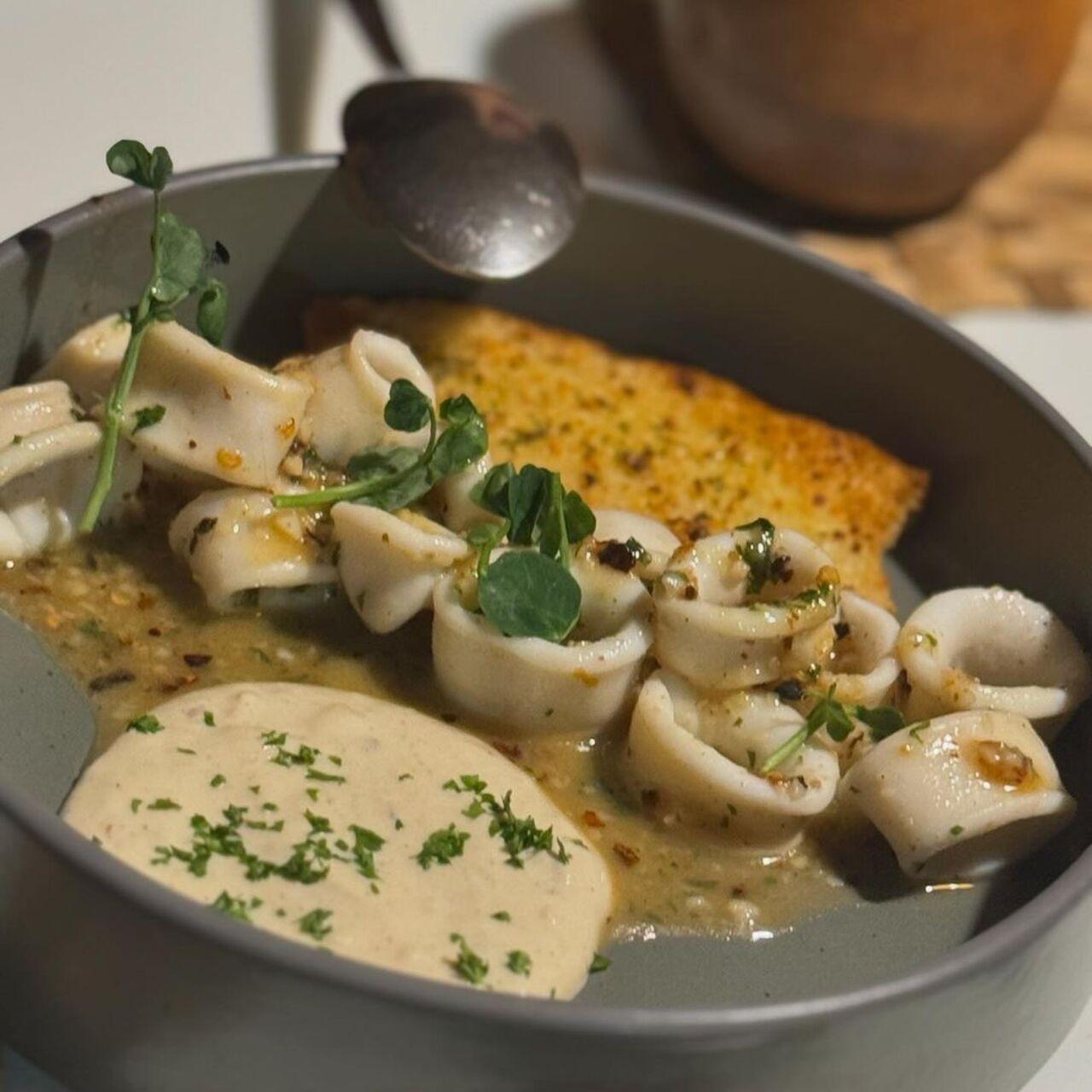 Butter Garlic squid with a white wine sauce at Cavatina by Avinash Martins.