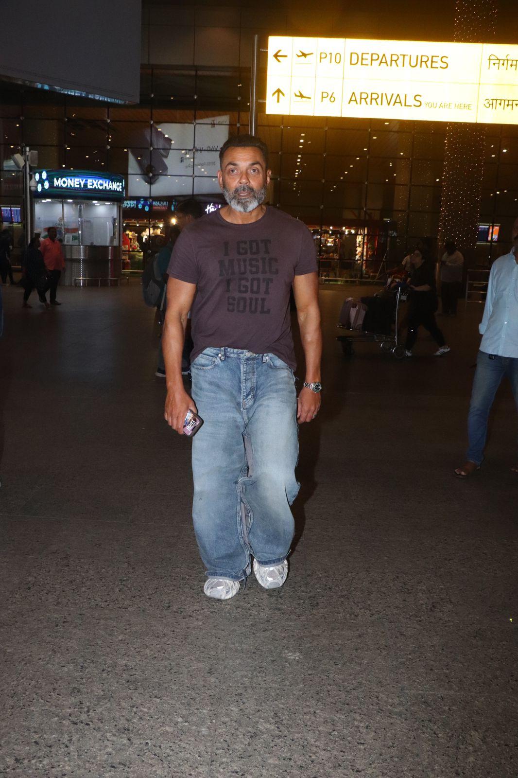 Bobby Deol kept it casual as he wore a loose pant and stylish loose Tshirt for his airport look
