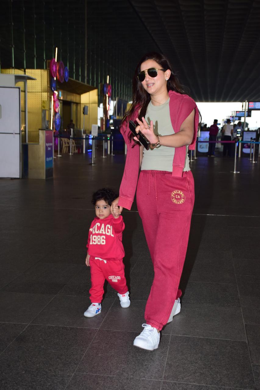 Gauahar Khan was snapped at Mumbai airport with her son. The actress looked cute in a pink formal suit