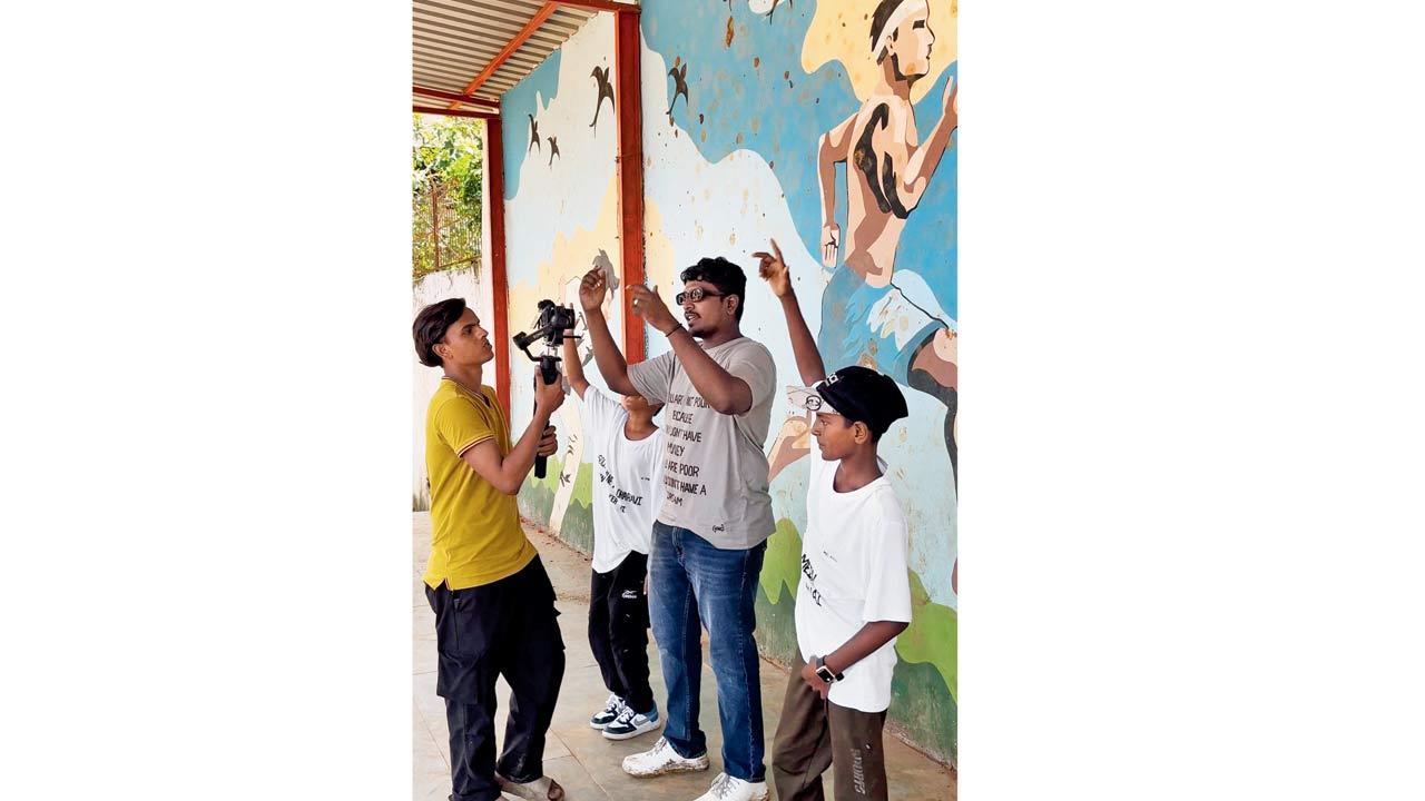 Joshua Joseph (centre) performs for the music video in Shahu Nagar 