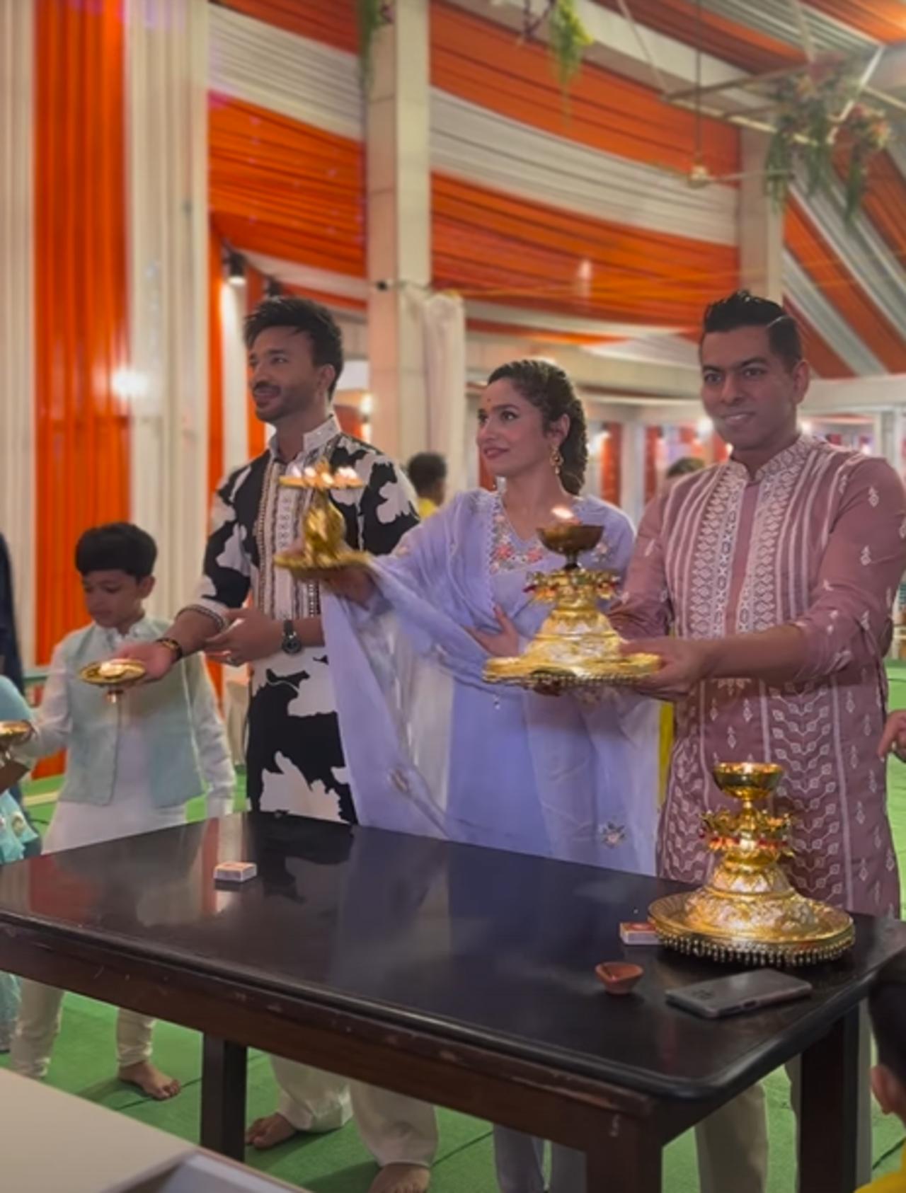 Another picture shows Ankita and Vicky in traditional attire once again. Vicky is wearing a black printed kurta, while Ankita is in a plain purple suit.