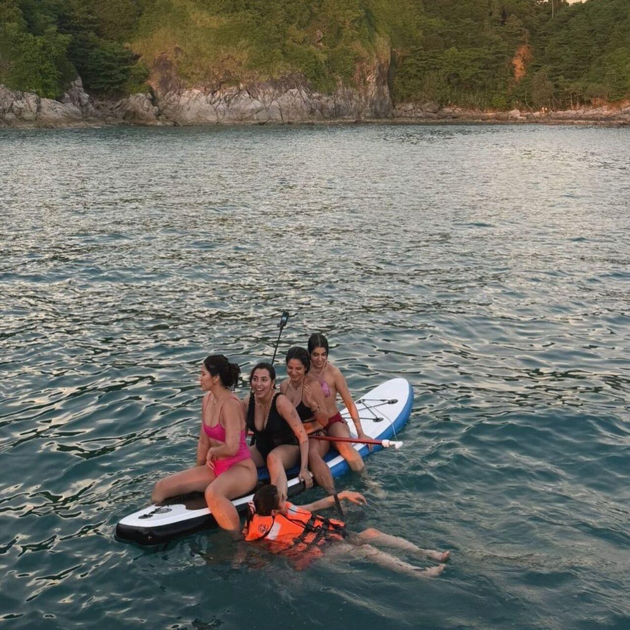 The girls also climbed up on a surfboard and took goofy pictures.