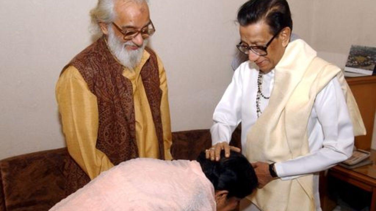 Lata Mangeshkar receiving blessings from Bal Thackeray while Shiv Shahir Babasaheb Purandhare looks on, during the release function of Mohan Wagh's book on photography at MIG Cricket Club in Bandra East