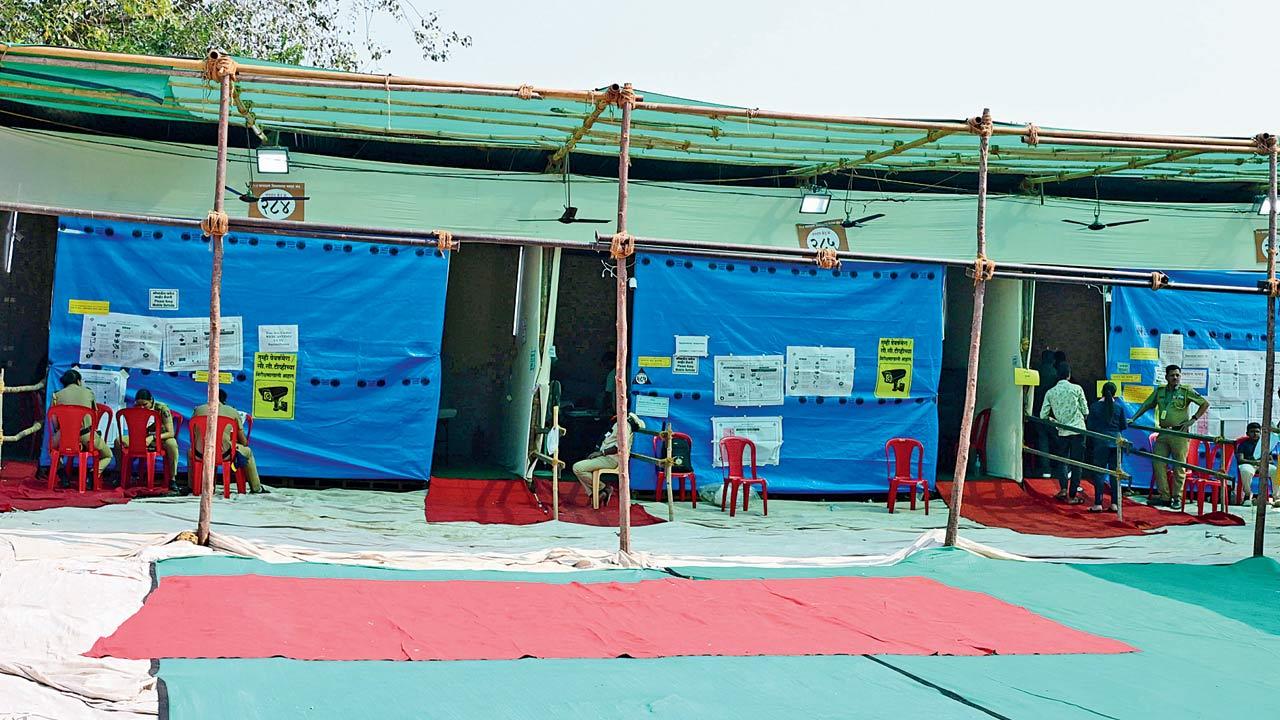 A handful of voters are seen at a polling centre in Damu Nagar, Kandivli East on Wednesday. Pic/Nimesh Dave