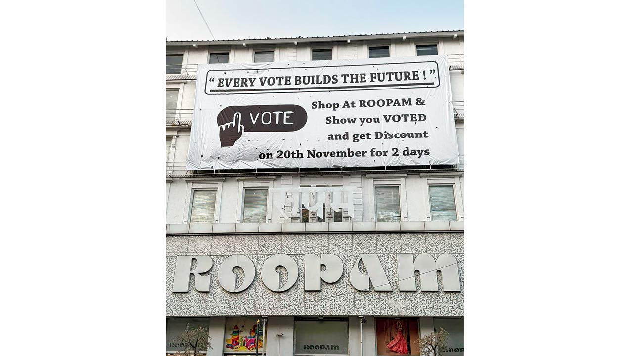 The store has put up a banner announcing discounts for those who show their inked finger