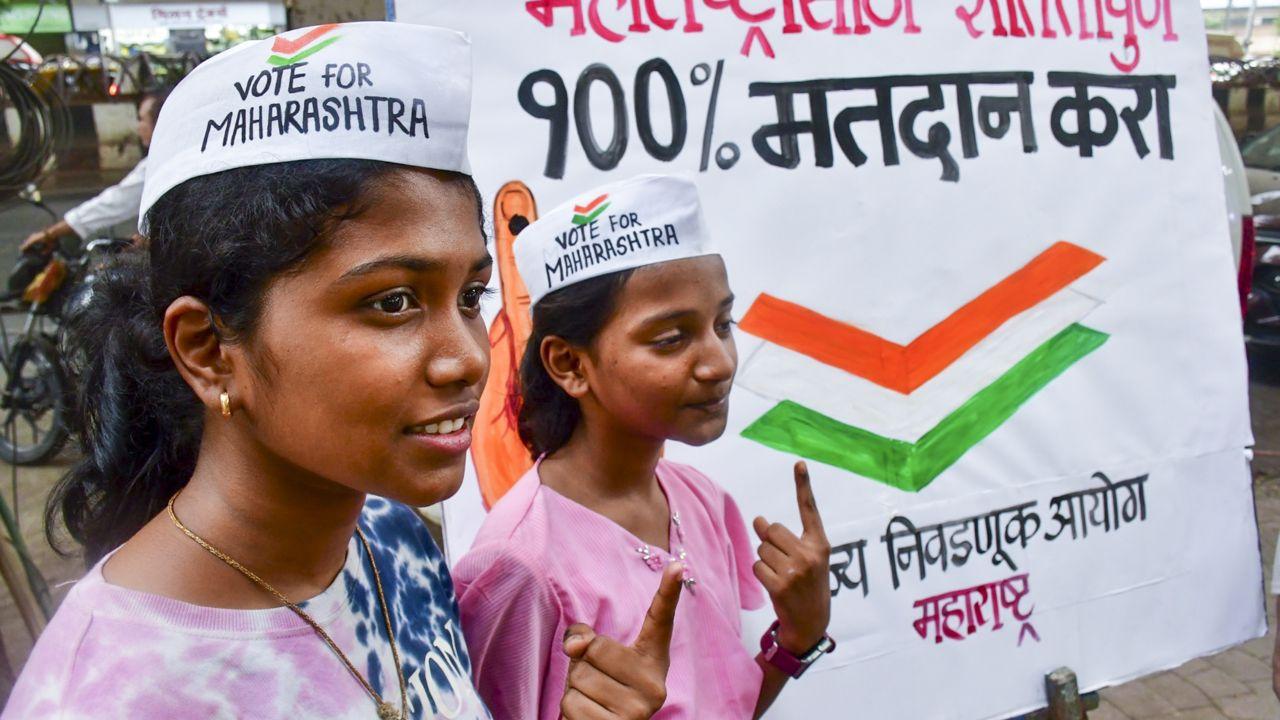 Students of an art school urge citizens to cast their votes in the upcoming Maharashtra Assembly elections, at Lalbaug, in Mumbai, on Tuesday