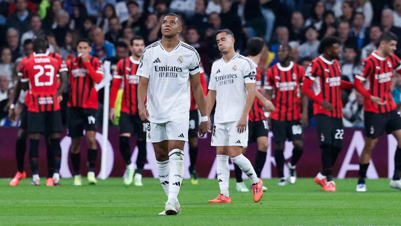 Real Madrid`s French forward Kylian Mbappe (CL) and Real Madrid`s Spanish defender Lucas Vazquez (CR) react after AC Milan scored a goal during the UEFA Champions League, league phase day 4 football match between Real Madrid CF and AC Milan at the Santiago Bernabeu stadium in Madrid. Pic/AFP