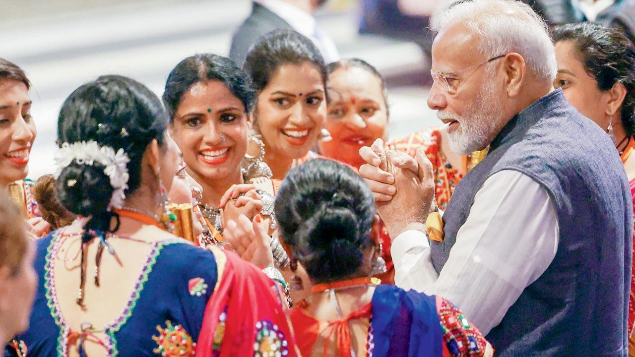 Modi interacts with members of the Indian diaspora. Pic/AFP