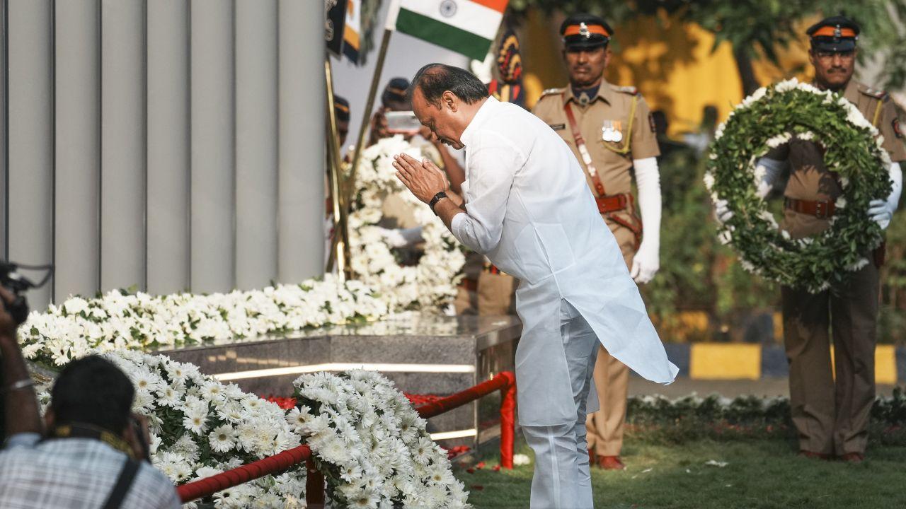 Maharashtra Deputy Chief Minister Ajit Pawar pays tribute to martyrs of the 2008 Mumbai terror attacks, on the anniversary of the gruesome incident, at CP office in Mumbai on Tuesday. (Pic/ PTI)