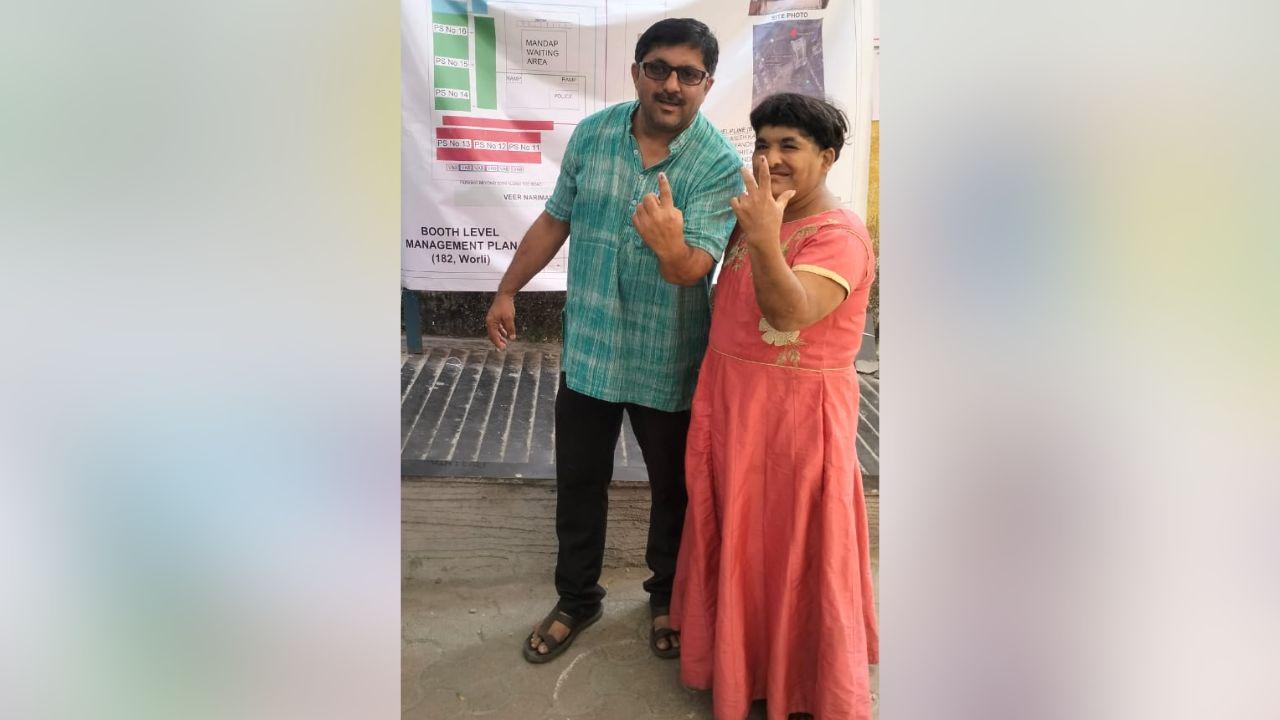 Person with Disability Ms Yamini Solanki, exercising her right to vote at Worli Assembly election escorted by her brother Adv Dhanpal Solanki
