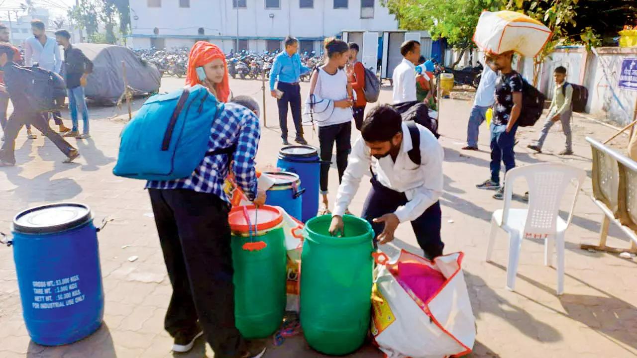 Several passengers were carrying large plastic drums, sacks and oversized luggage with them