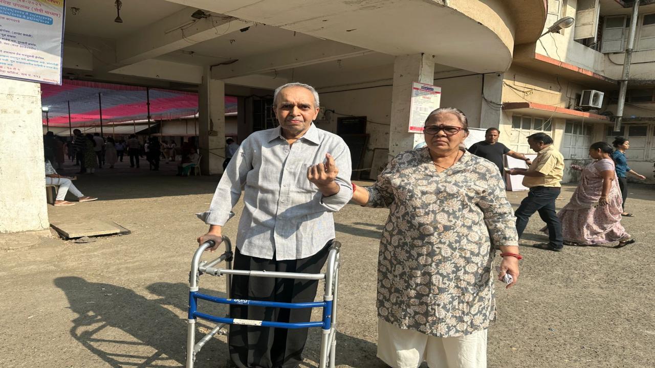 Prakash Dave, 70, and his wife Daxa Dave, 65, cast their votes at Viva college