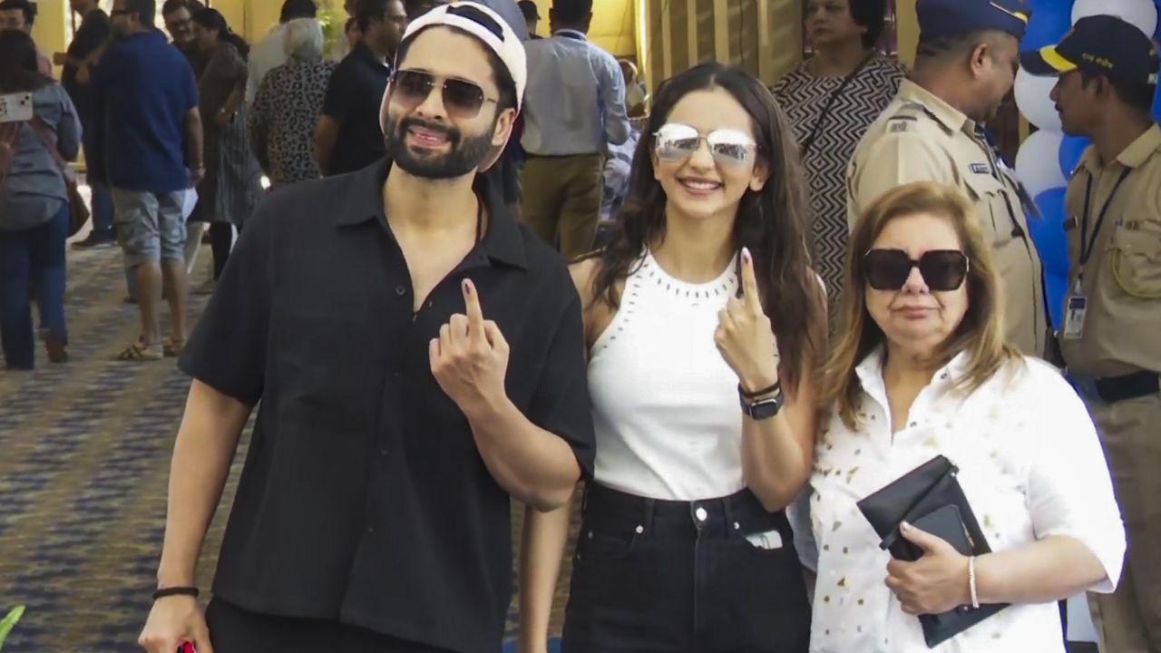 Actor Rakul Preet Singh with husband and actor-producer Jackky Bhagnani shows her ink-marked finger after casting vote in Mumbai. (Pic courtesy: PTI)