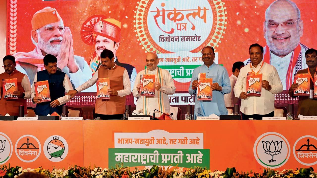 Union Ministers Amit Shah and Piyush Goyal, DCM Devendra Fadnavis, and other BJP leaders release the party’s manifesto. Pic/Atul Kamble