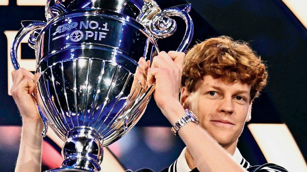 Jannik Sinner celebrates with World  No. 1 trophy