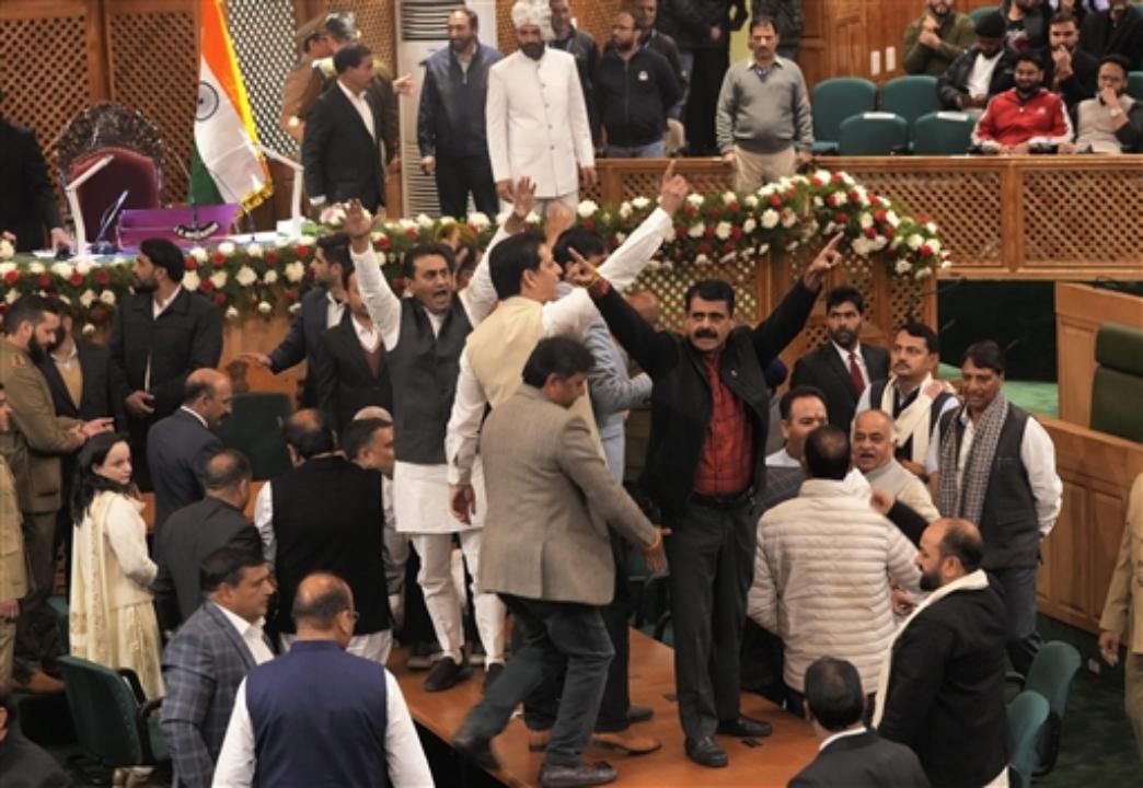 BJP legislators protest inside the Assembly after the passing of the resolution on Article 370 restoration by voice vote in Srinagar.