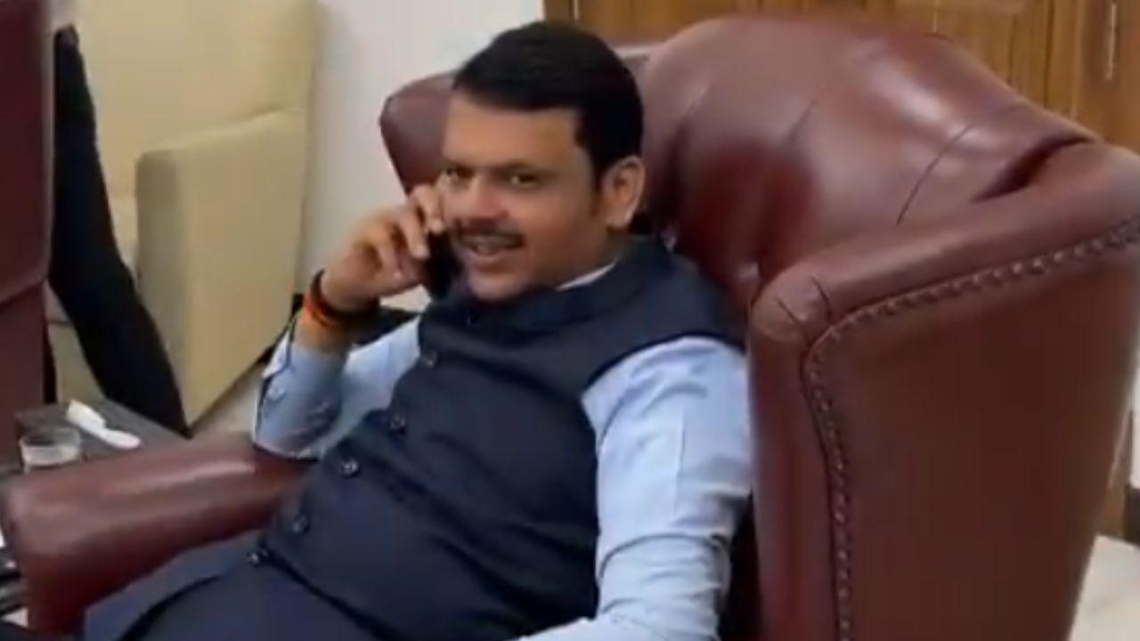 Maharashtra Deputy CM and BJP candidate from Nagpur South-West, Devendra Fadnavis, is seen talking on the phone at his Mumbai residence as counting for Maharashtra Elections 2024 continues (Pic/PTI)