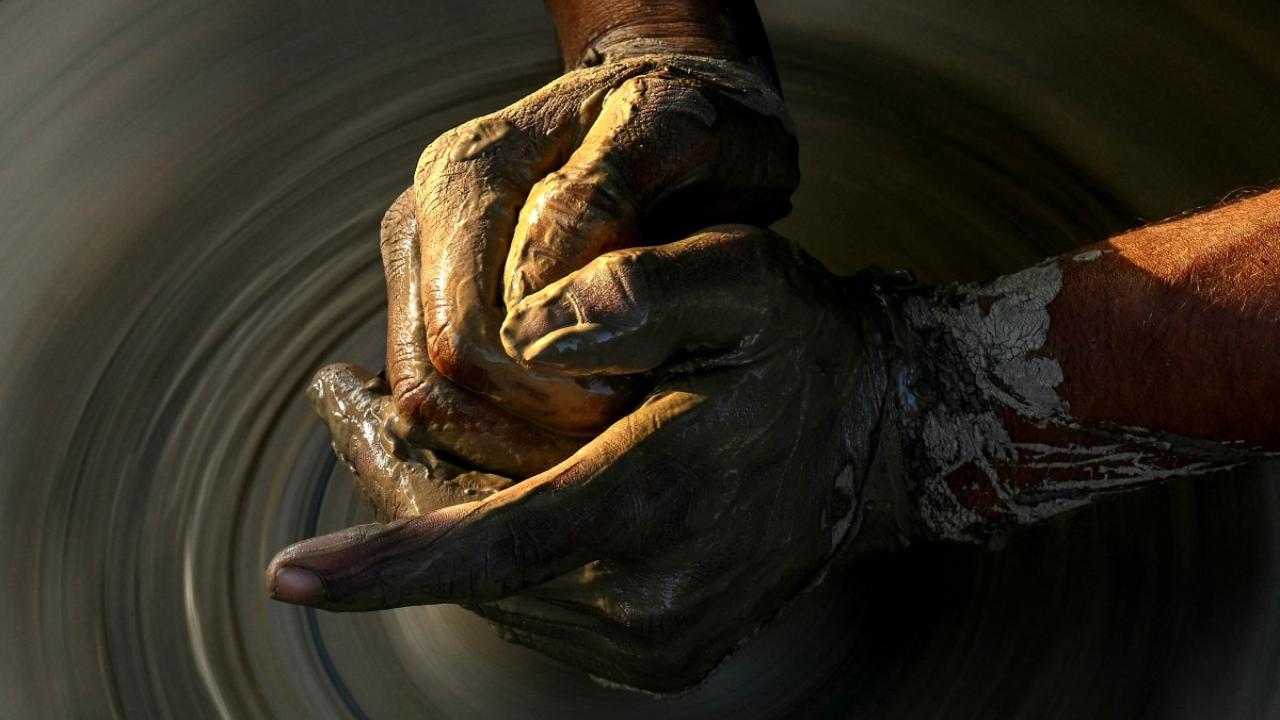 A potter makes diyas ahead of Diwali, the Hindu festival of lights, at a workshop in Faridabad