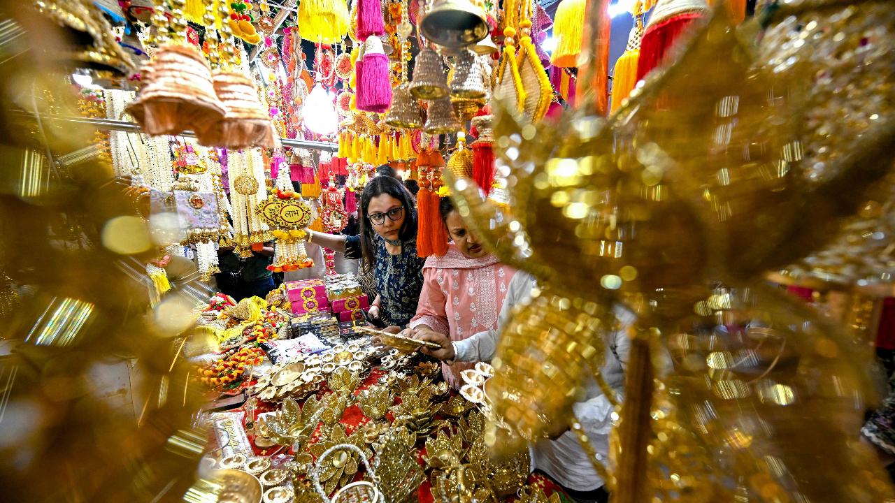 People buy decor items ahead of Diwali at a local market in Faridabad