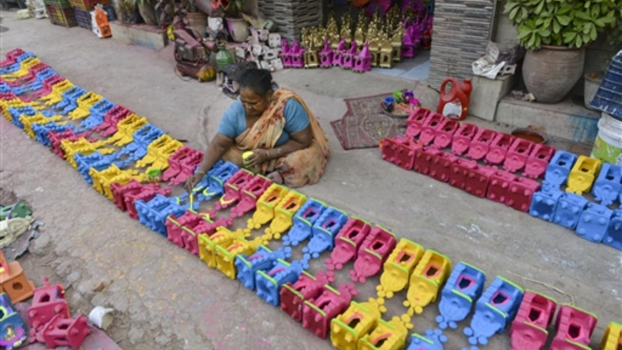 A potter prepares clay lanterns in Jalandhar