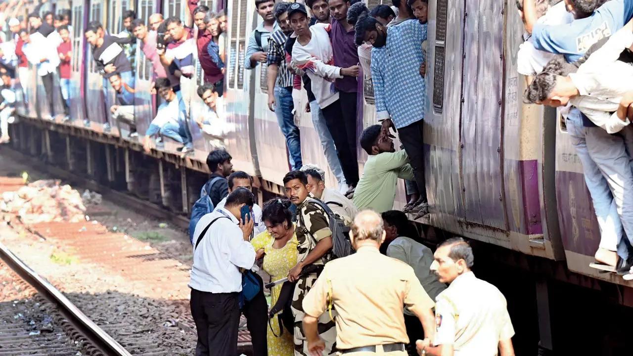 Officials gently guide the shaken woman to the opposite platform