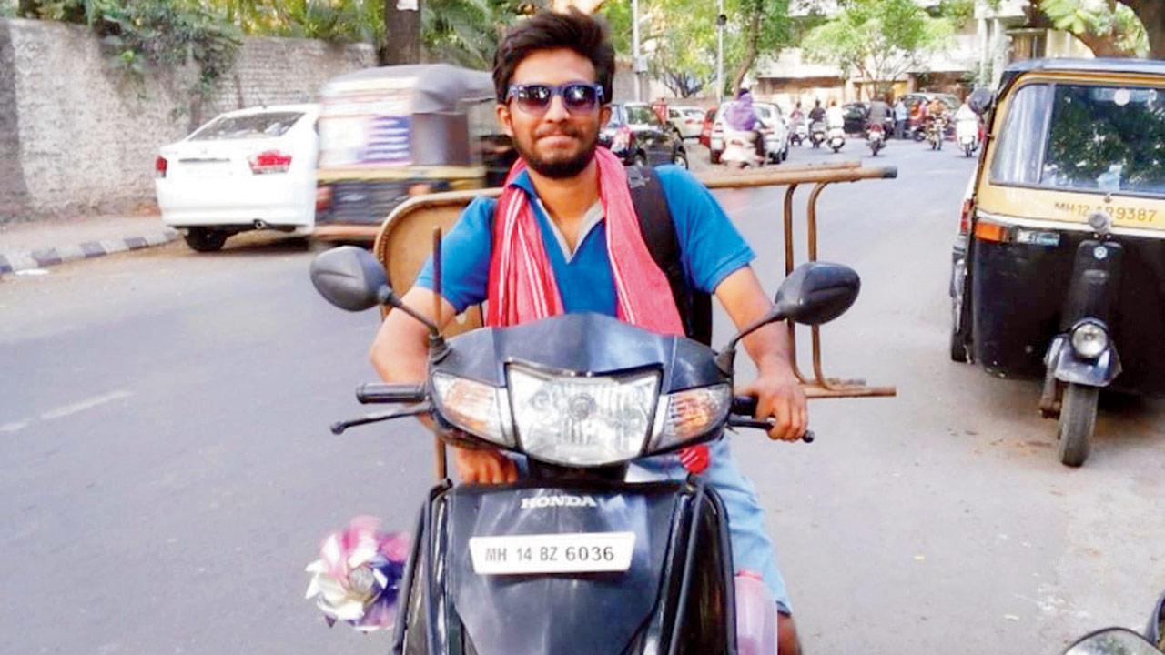 Abhay Chaugule on his black Activa that was allegedly stolen