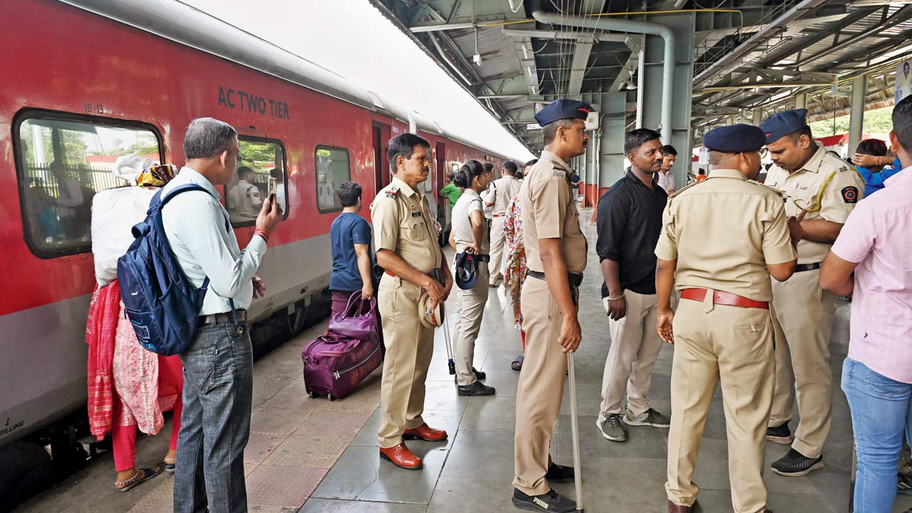Police officers at the site of the stampede in which 10 people were injured