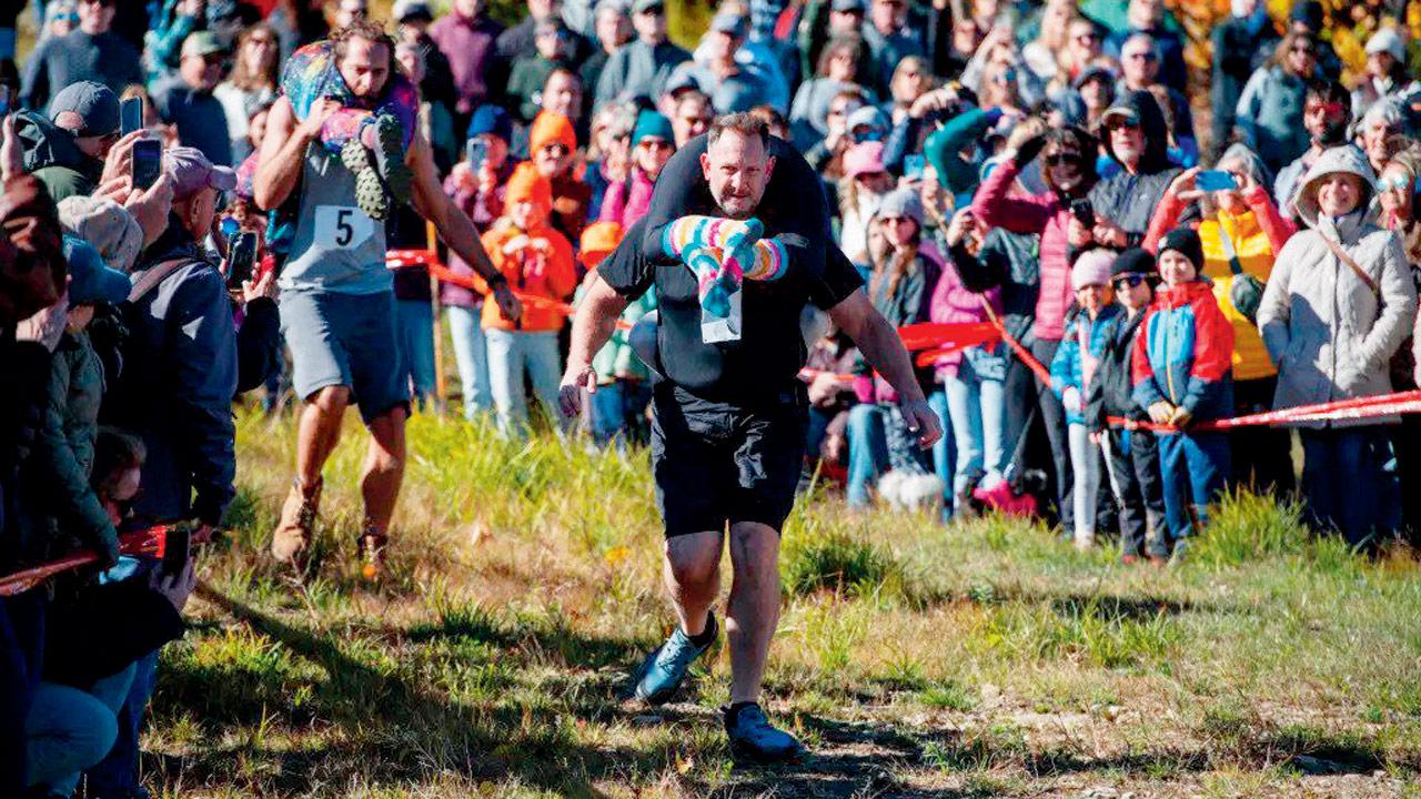 Spouses race at the 25th North American Wife-Carrying championship