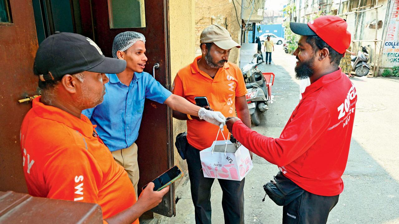 Delivery partners collecting food from the South Mumbai-based cloud kitchen, The Pantry