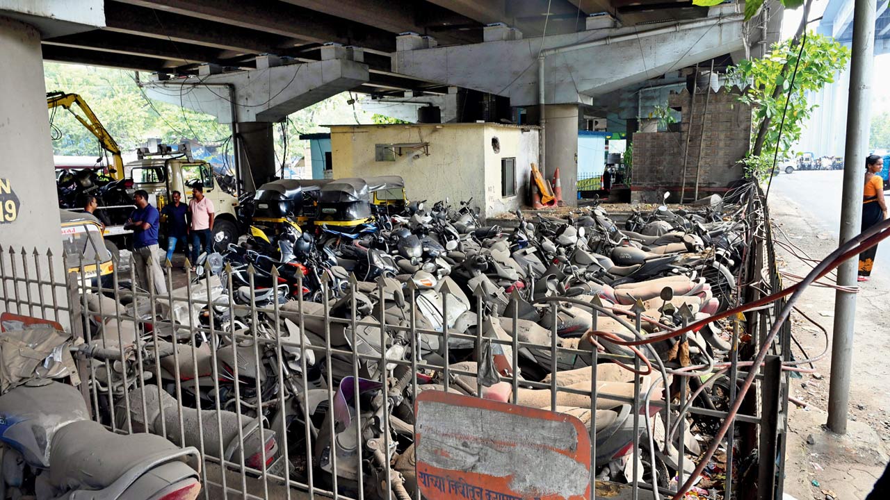 Towed and abandoned vehicles take up space at this spot. Pic/Nimesh Dave