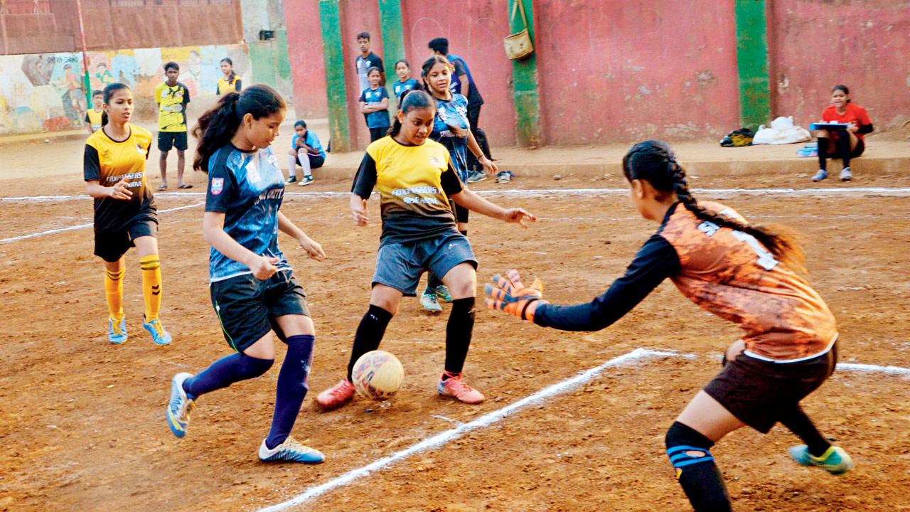 Girls play a football match at a previous tournament in Govandi