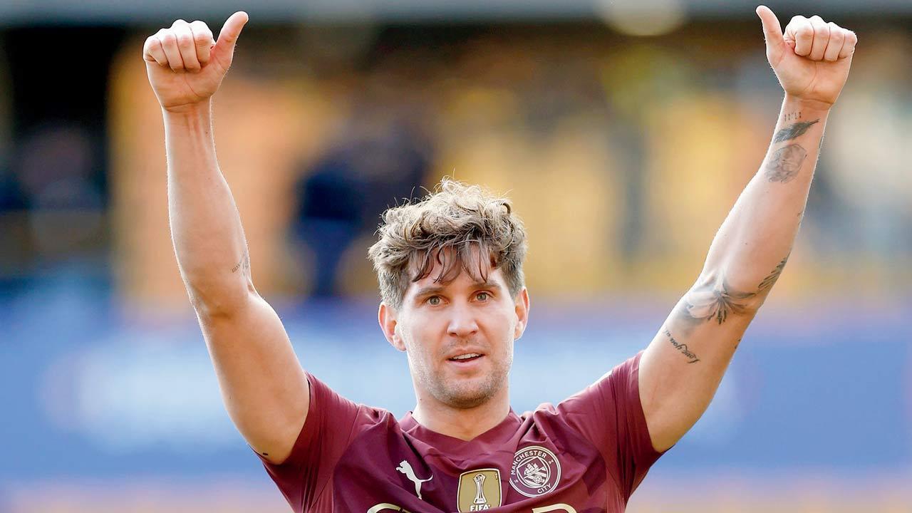 Stones’ winner helps City survive Wolves scare