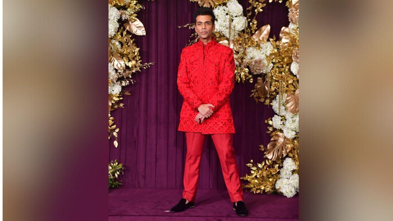 Leading from the front in his bold avatar, Karan Johar walked in with a red ensemble in different shades of the colour, clearly making a fashion statement as always.
