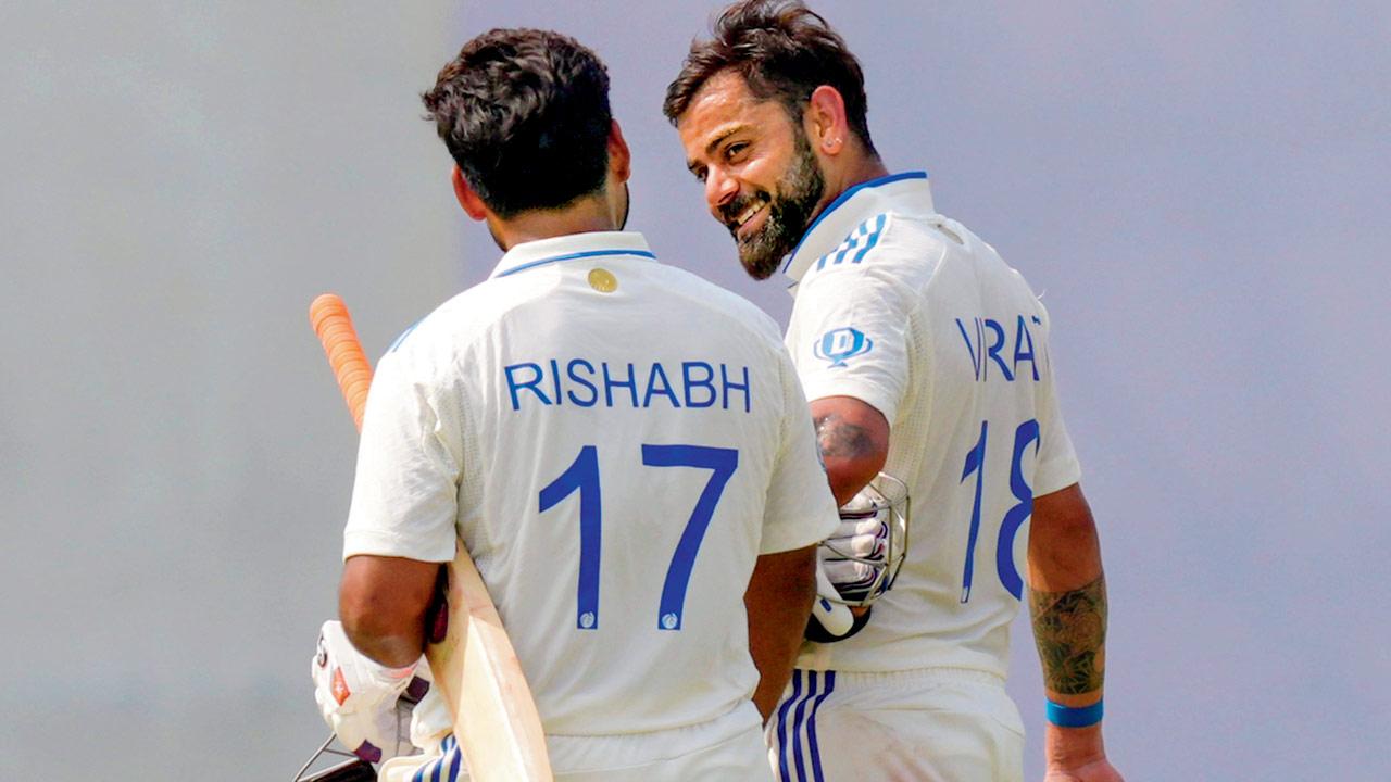India’s Virat Kohli and Rishabh Pant walk back after winning the second Test against Bangladesh, at Green Park, Kanpur, on Tuesday. PIC/PTI