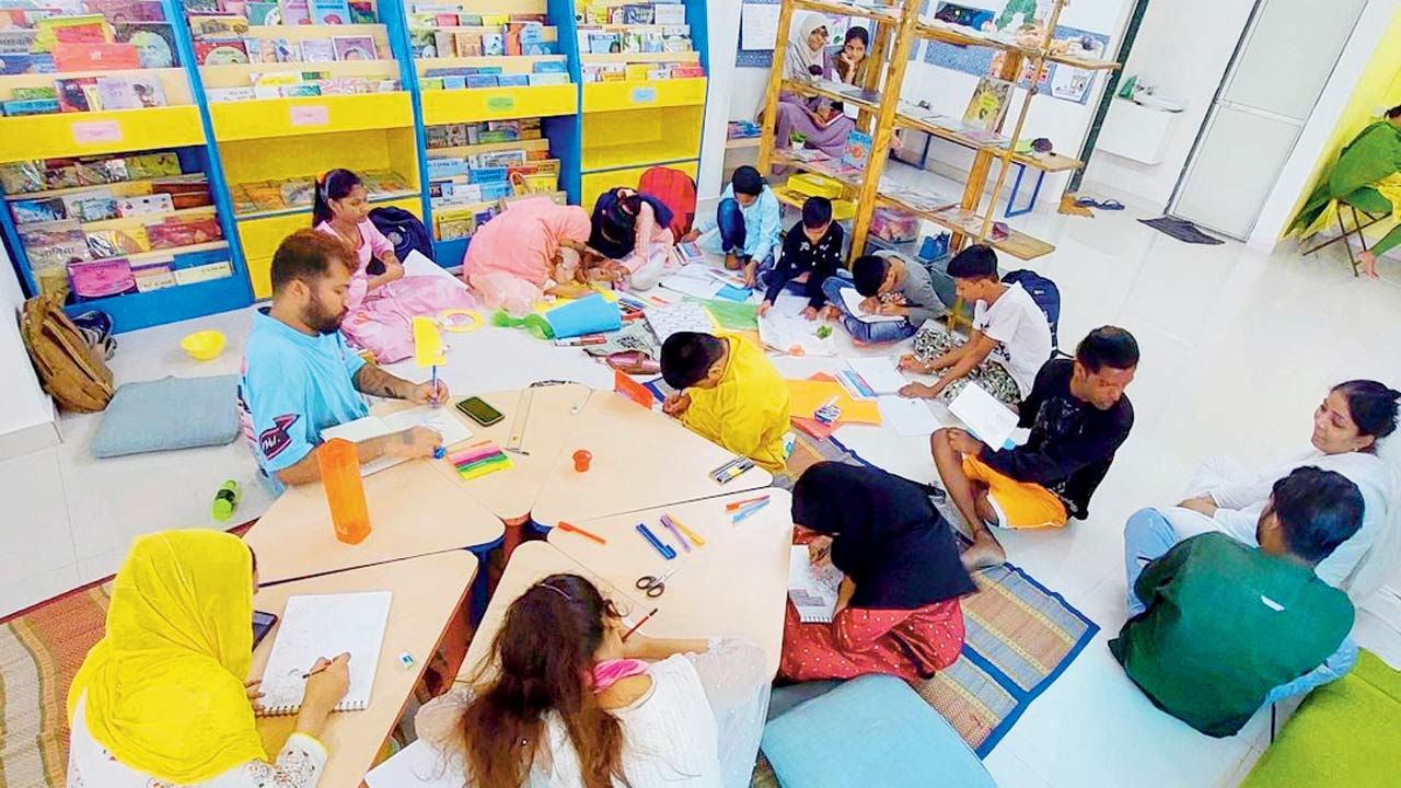 Members of the community at Kitab Mahal, an open library for readers 