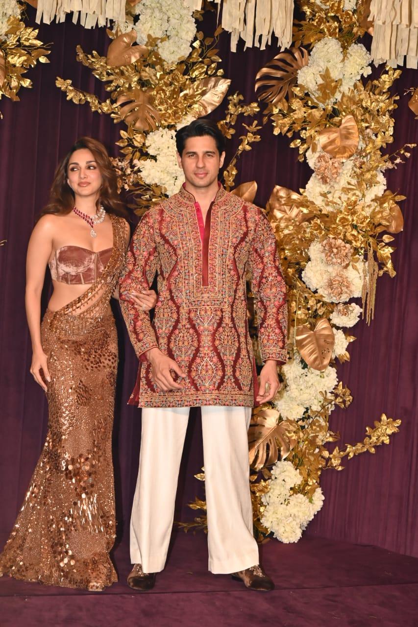 The other best-dressed couple, Sidharth Malhotra and Kiara Advani arrived for the bash. Kiara chose a golden glittery saree paired with a strapless blouse, while Sidharth wore a multi-coloured, heavily embroidered kurta with white pants.