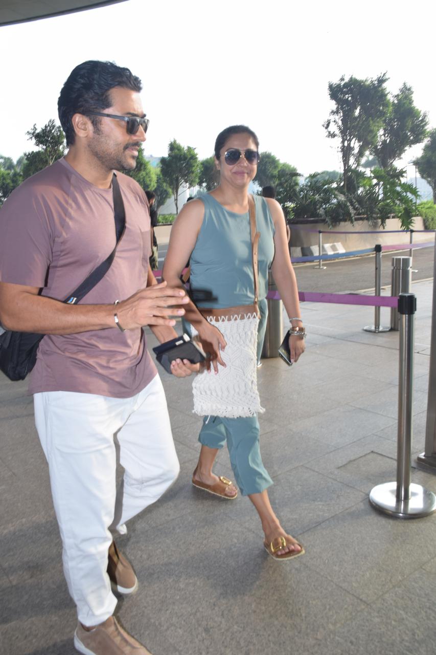 Surya and his wife Jyothika were clicked at Mumbai airport as they departed from the city