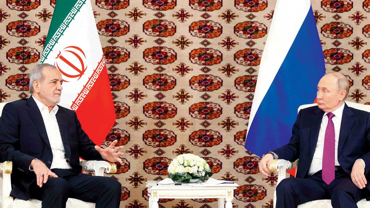 Vladimir Putin meets Iranian counterpart in Turkmenistan